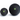 Two black massage balls with green logos on a white background