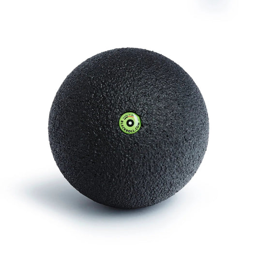 Black massage ball with a green logo on a white background