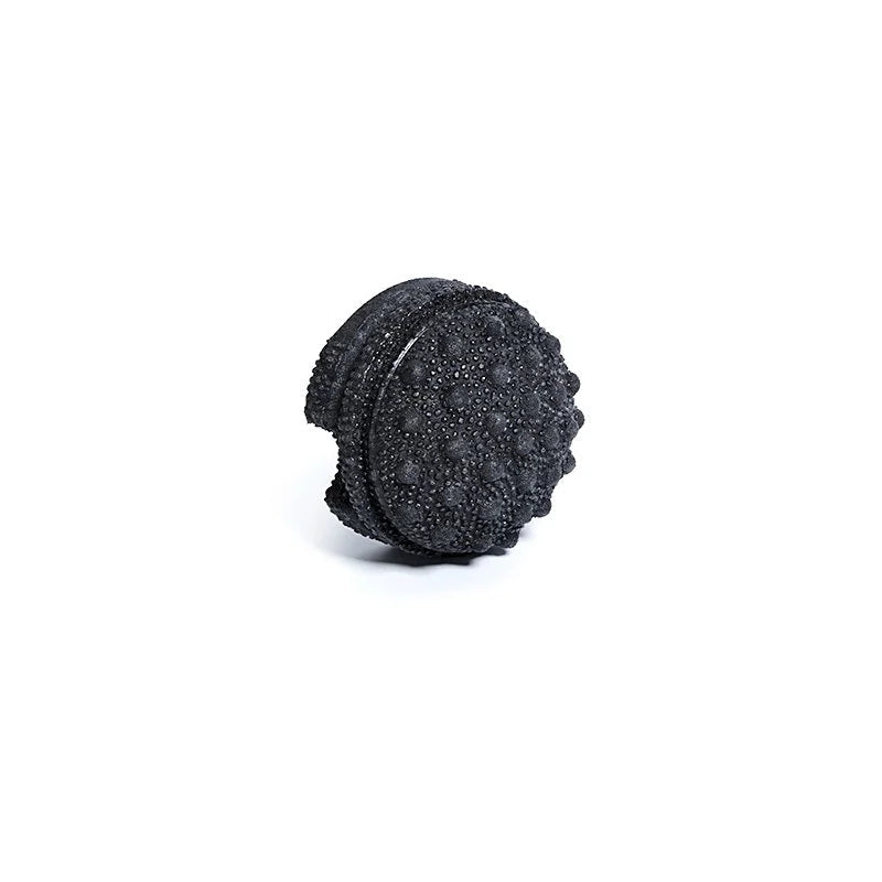 Black textured foam roller on a white background