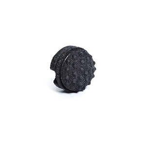Black textured foam roller on a white background